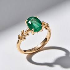 Oval Green Emerald With Leaf Accents Ring